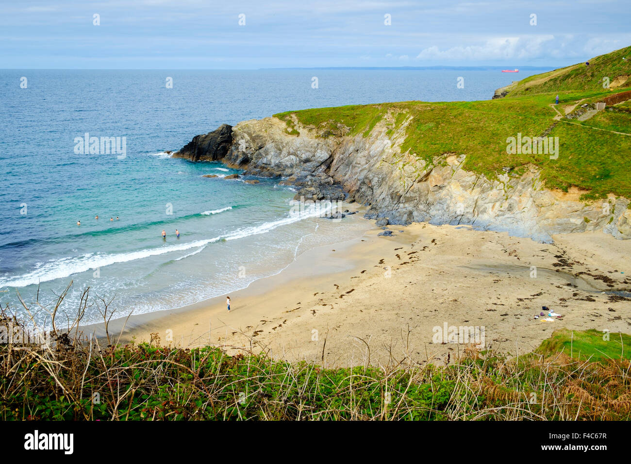 Polurrian Beach, Mullion, Cornwall, England, UK - with people swimming Stock Photo
