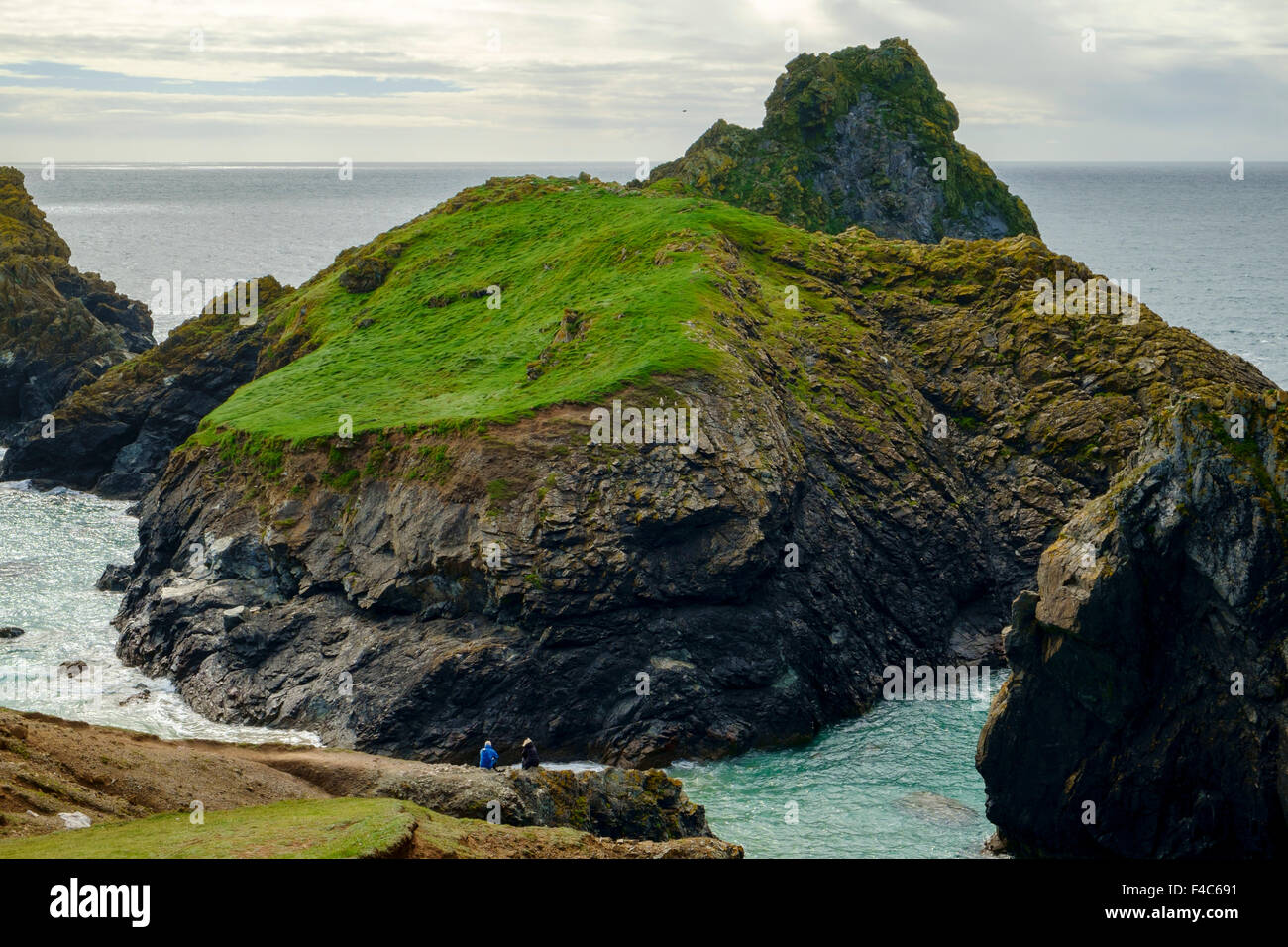 Rocks at Kynance Cove, Cornwall, England, UK - at high tide from the South West Coast path Stock Photo