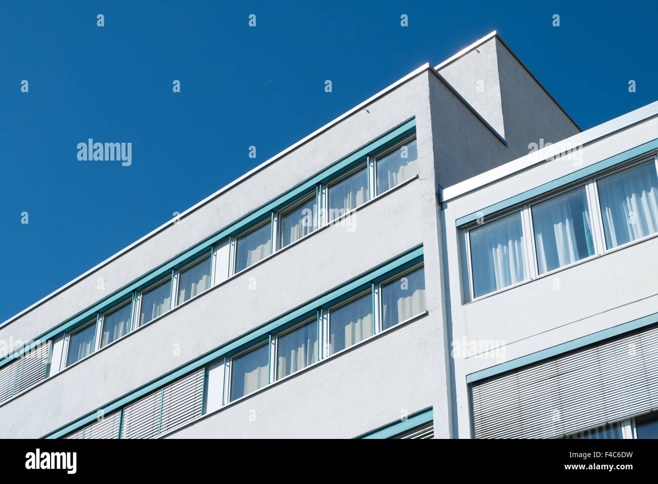 Office building for business with windows and blue sky Stock Photo - Alamy