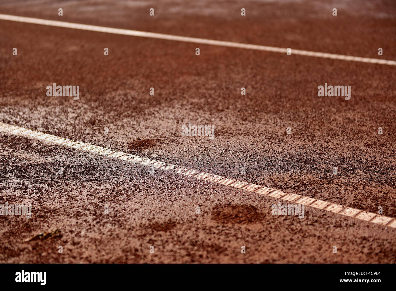 Detail shot with a wet tennis clay court Stock Photo
