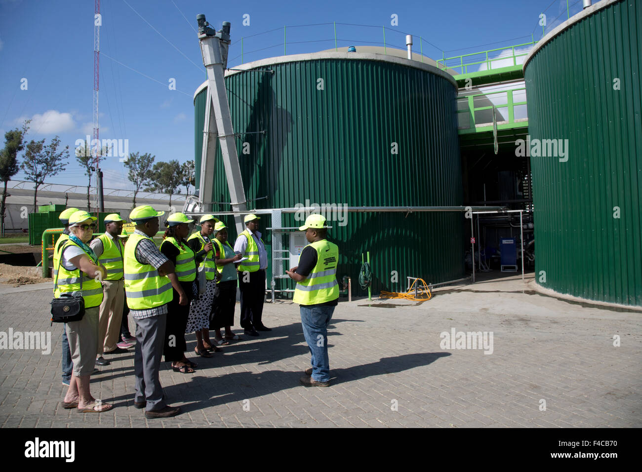 East African teachers visiting 2.4 MW Biogas Biojoule plant anaerobic digestion Gorge Farm Energy Park Lake Naivasha Kenya Stock Photo