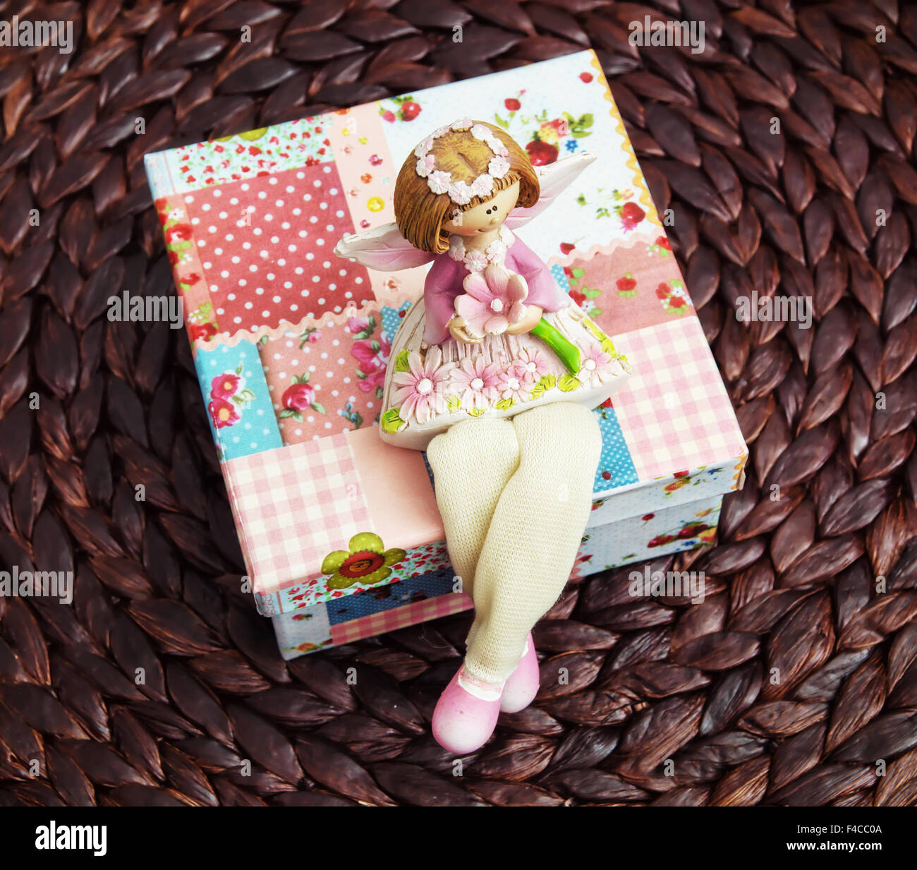 Sugar dolly sitting on the decorative box Stock Photo Alamy