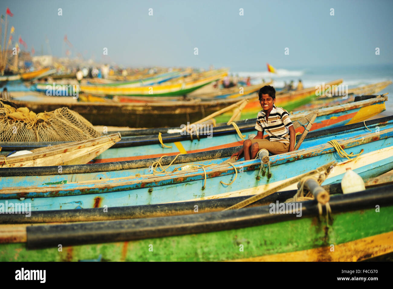 India Odisha Puri Small Boy On Local Colorful Fishing Boats