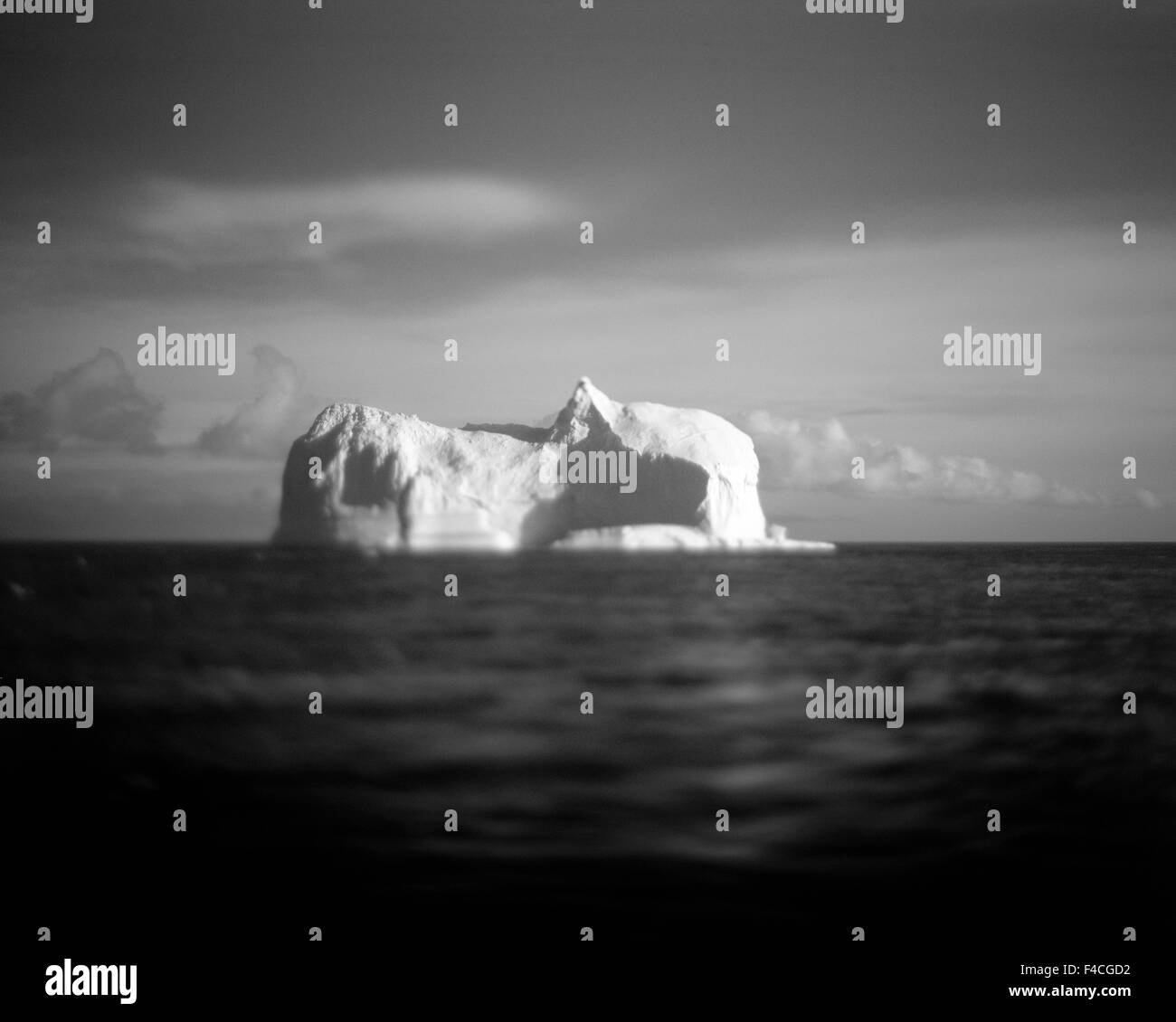 Antarctica, Blurred black and white image of massive tabular iceberg floating near Deception Island in the South Shetlands. Stock Photo