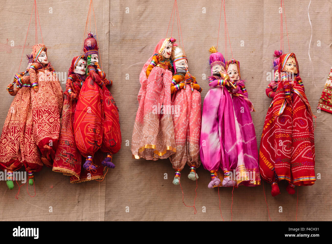India, Rajasthan, Jhunjhunu District, Mandawa, Puppets hanging on wall