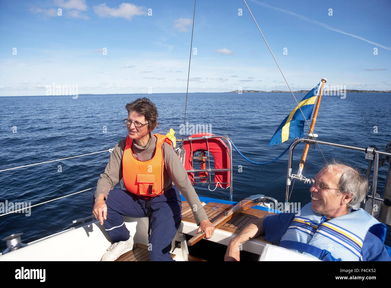 A couple in a sailing boat. Stock Photo