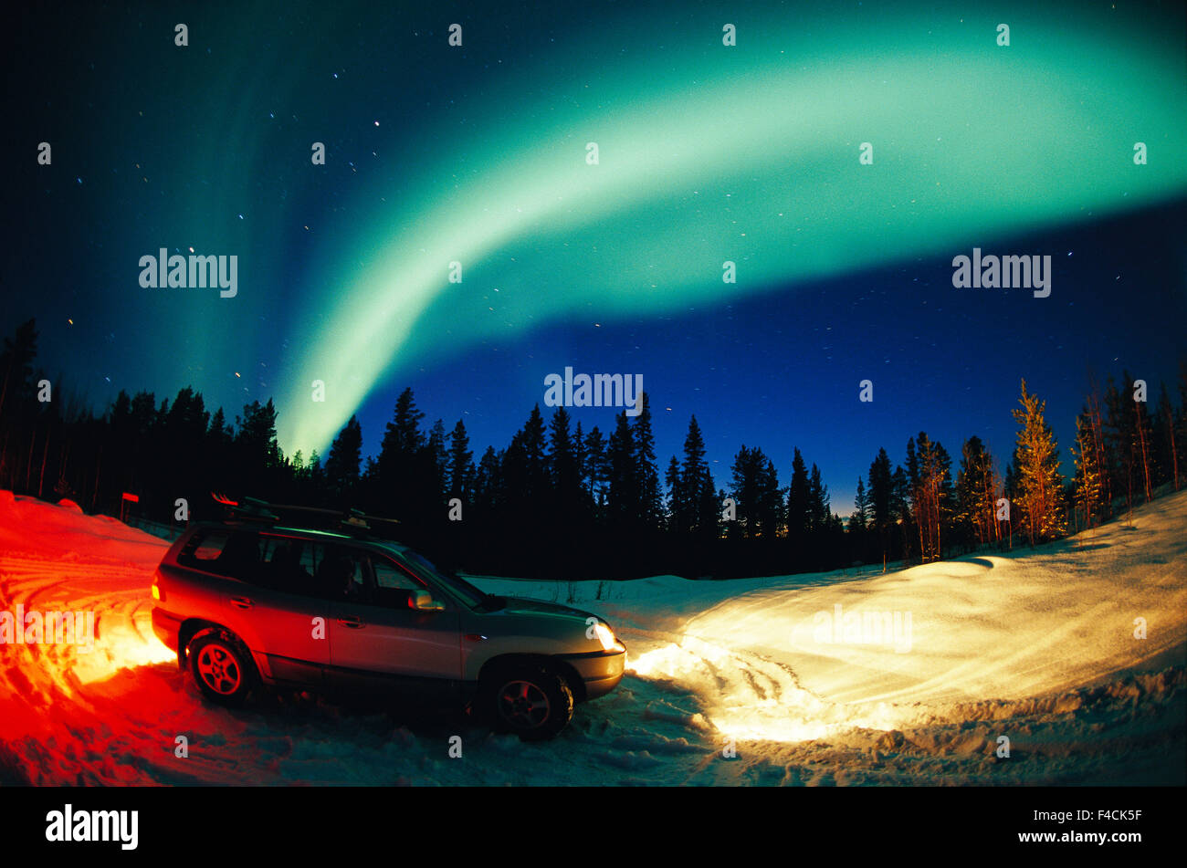 Northen light and car on the road. Stock Photo