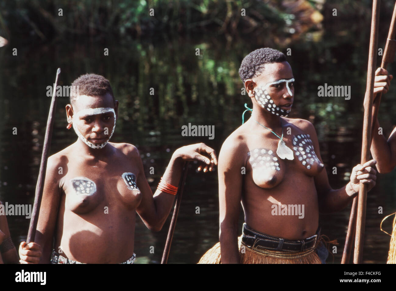 Indonesia, Irian Jaya, Asmat people standing in forest. (Large format sizes available) Stock Photo