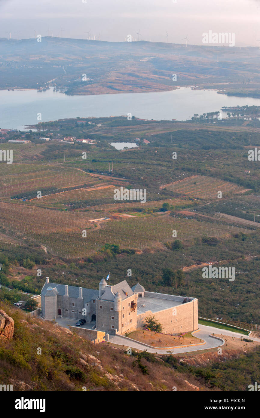China, Shandong province, Mulangou Village. Scottish castle replica Treaty Port winery sits above vineyards in Qiushan valley. Stock Photo