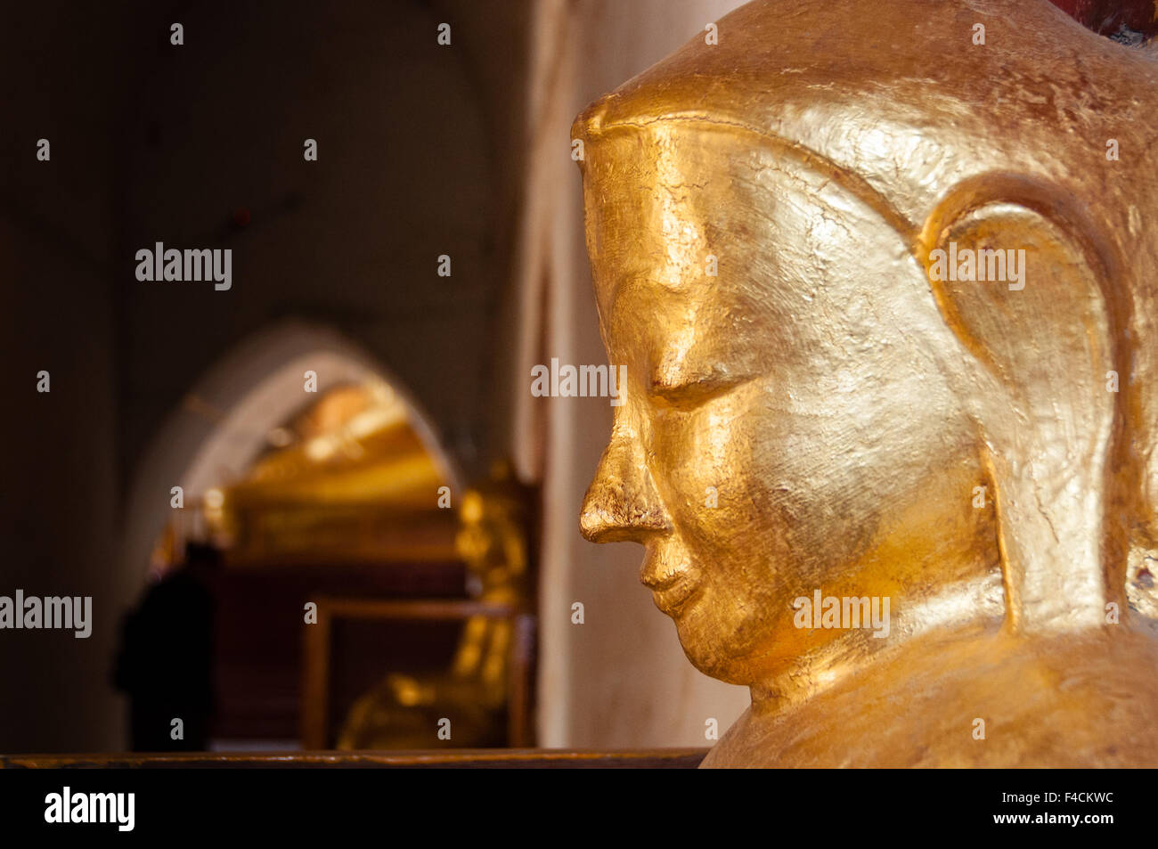 Buddha face gold statue side Stock Photo