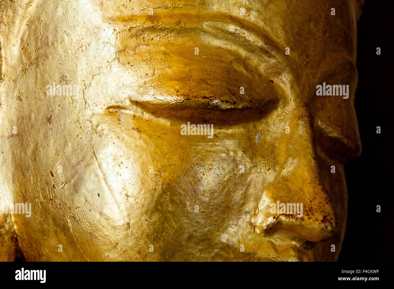 Buddha face gold statue close-up Stock Photo
