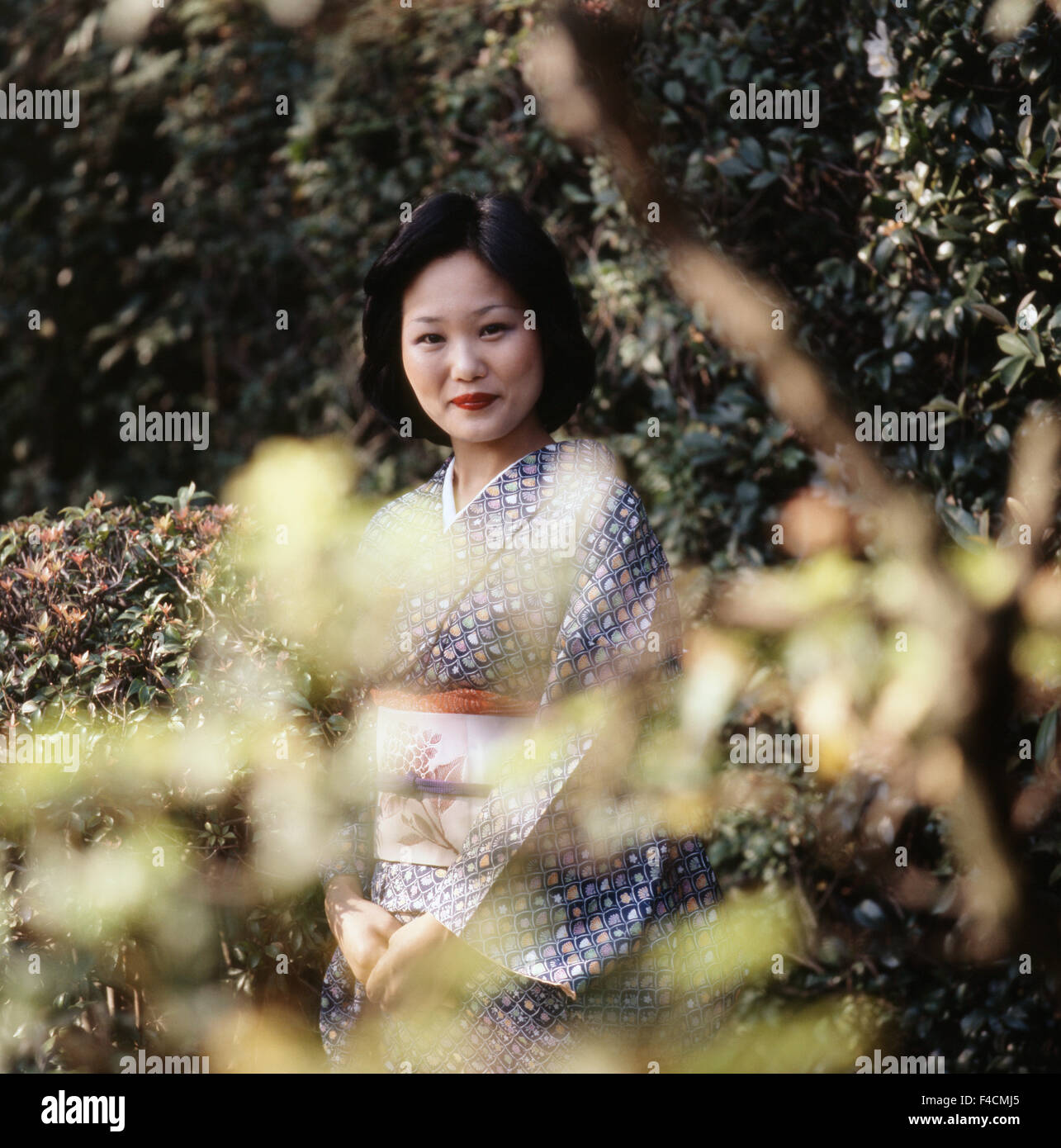 Japan, Kyoto, Japanese woman in kimono at garden (Large format sizes available) Stock Photo