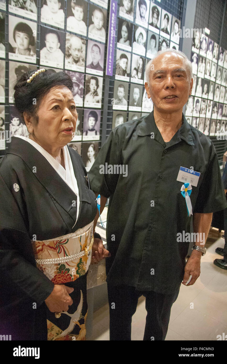 (L) Tsuneko Maria Miyagi, oldest living survivor of the WWII maritime tragedy with boy she saved from drowning in 1944. Hisashi Teruya in Tsushima Maru Memorial Hall, Naha, Okinawa, Japan on 70th anniversary of the disaster. Stock Photo