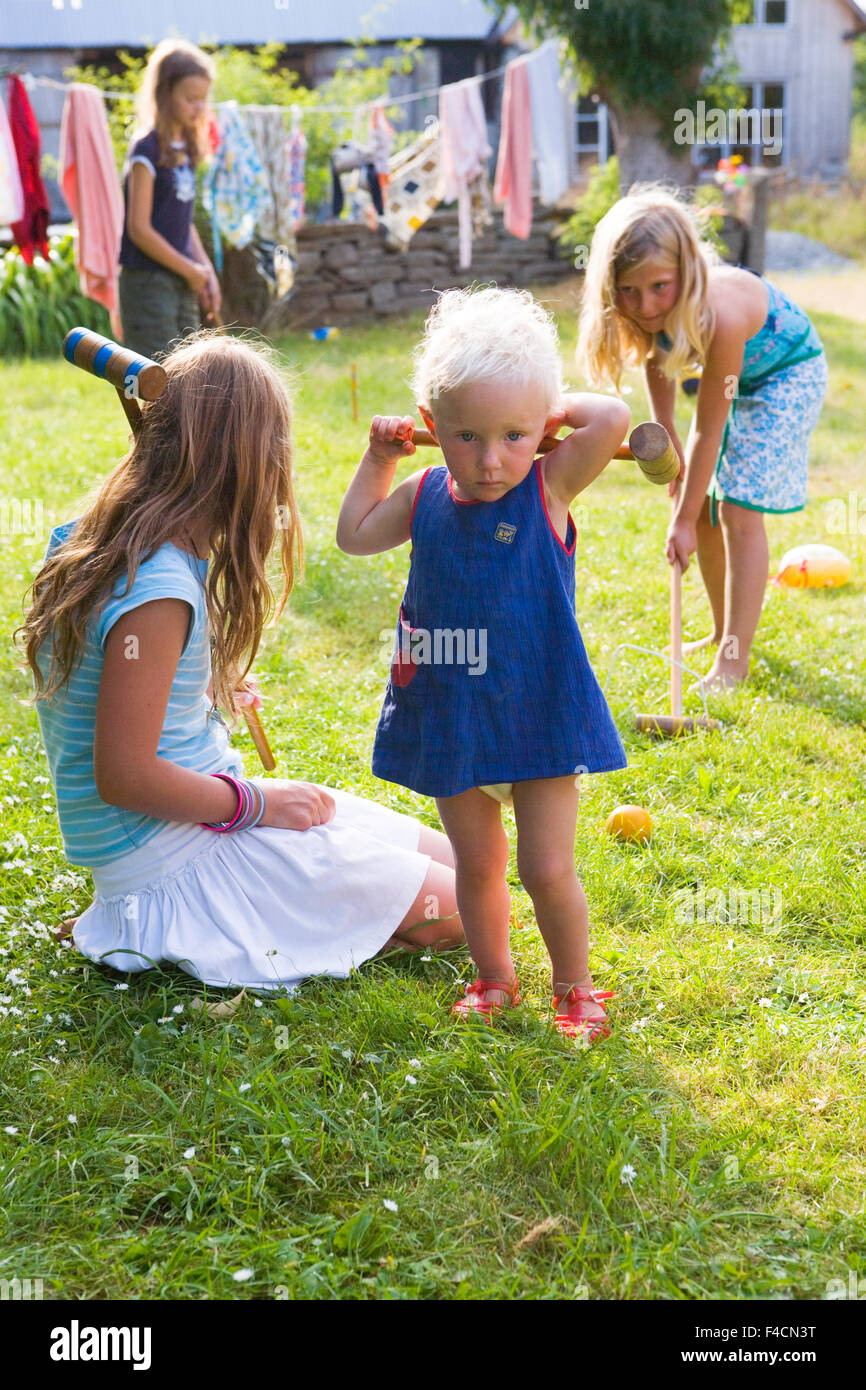 Girls playing croquet Stock Photo Alamy