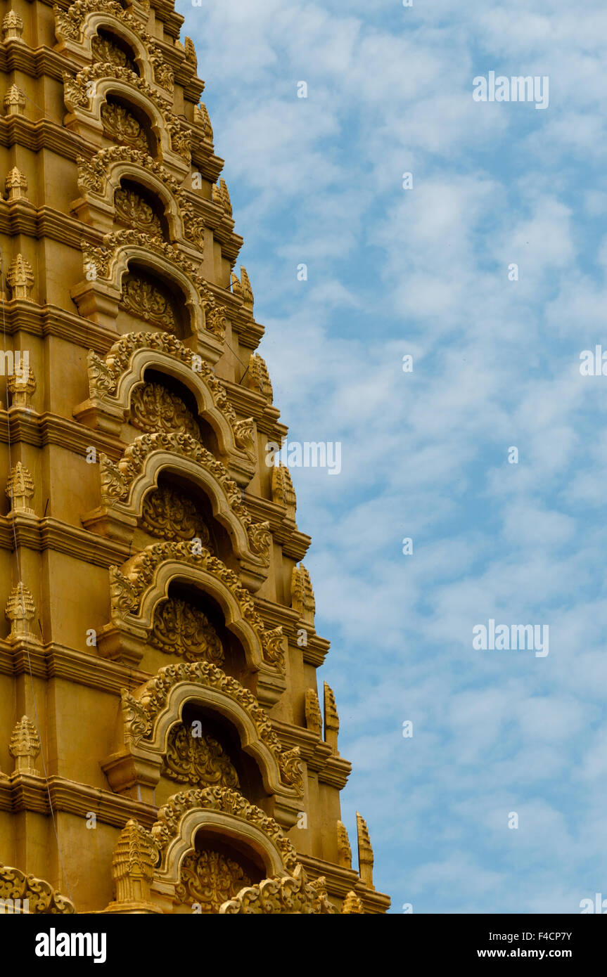 Close-up Golden temple in front of beautiful blue and cloudy sky Stock Photo