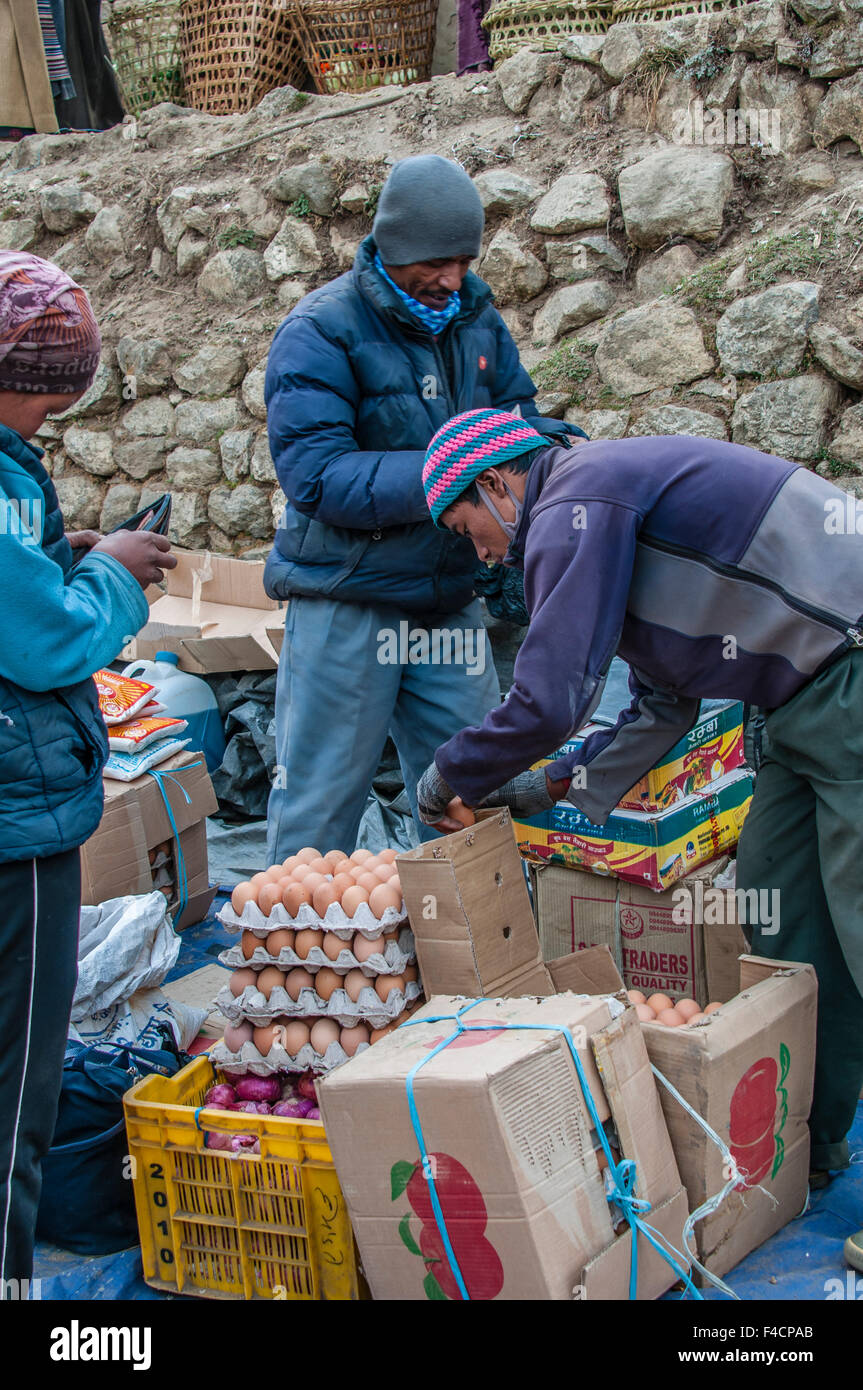 Man selling eggs at market in Namche Bazaar, Solukhumbu, Nepal Stock