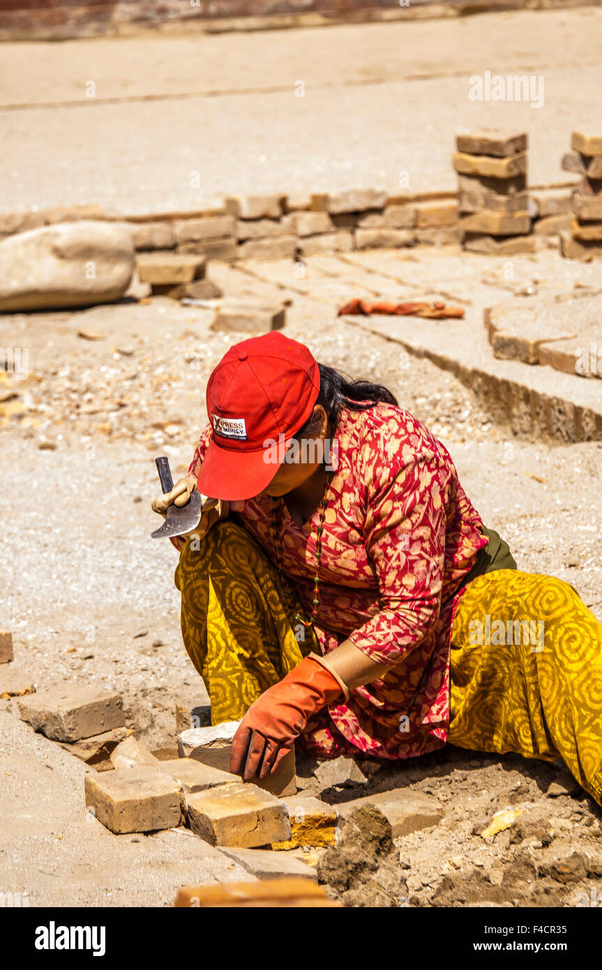 Woman laying bricks, Bhaktapur, Kathmandu, Nepal. Stock Photo