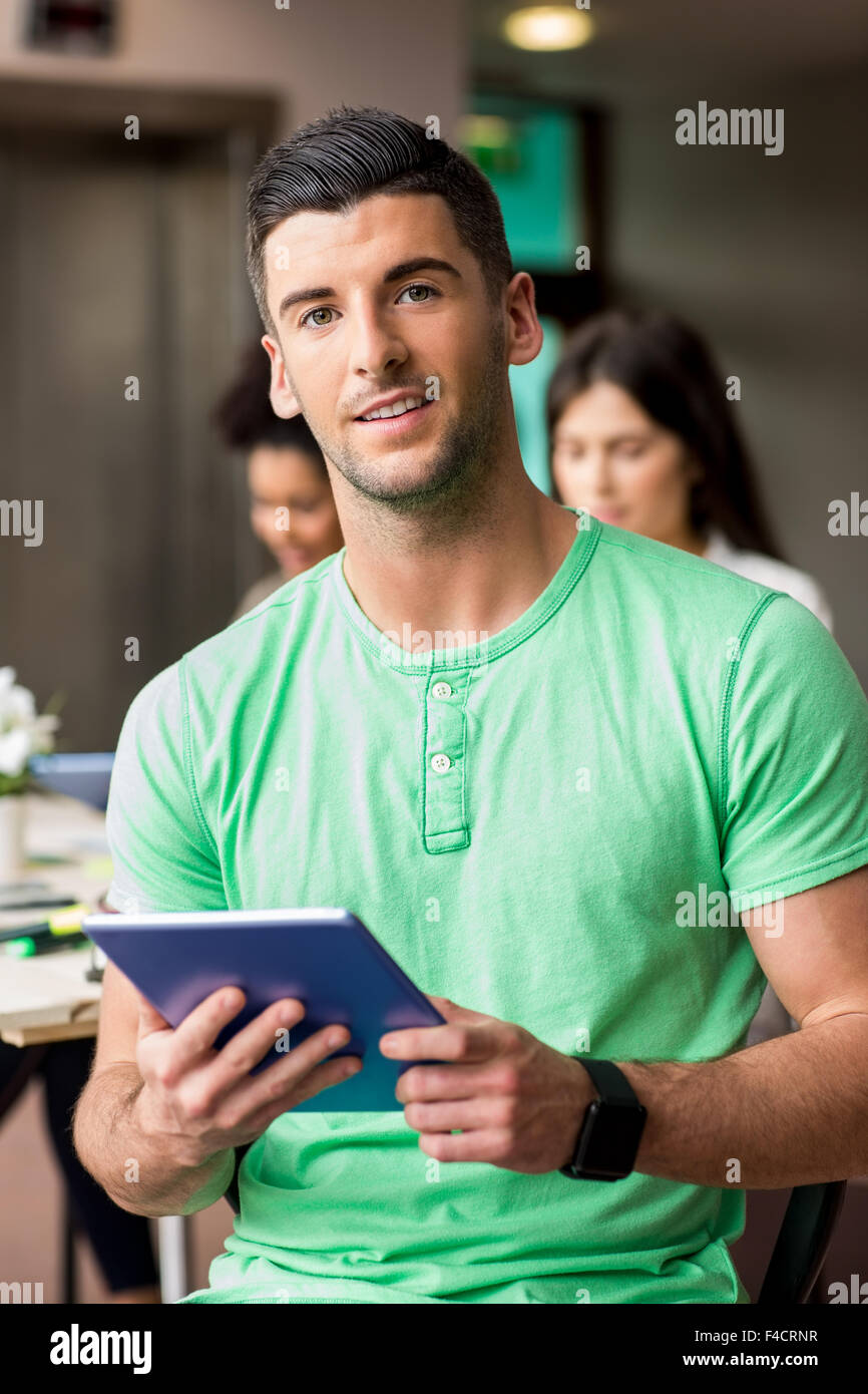 Student working on assignment with tablet Stock Photo - Alamy