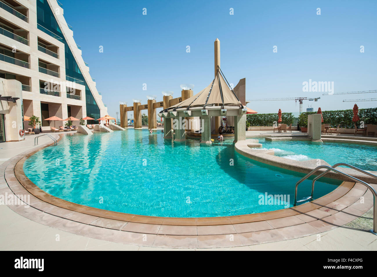 Pool area at the Raffles Dubai Hotel Dubai, United Arab Emirates Stock