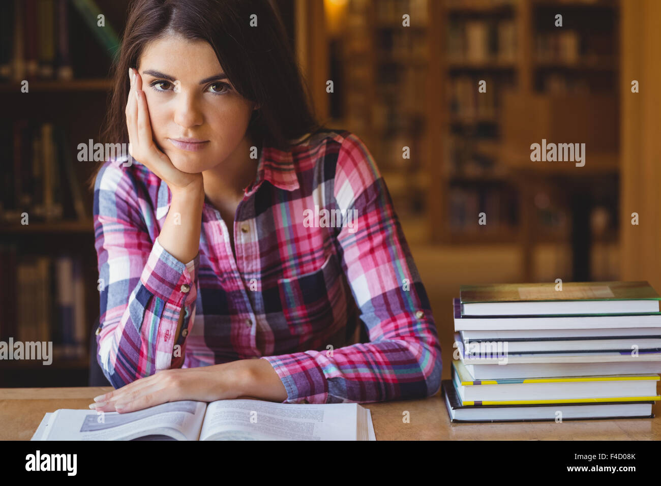 Portrait of female student with book Stock Photo