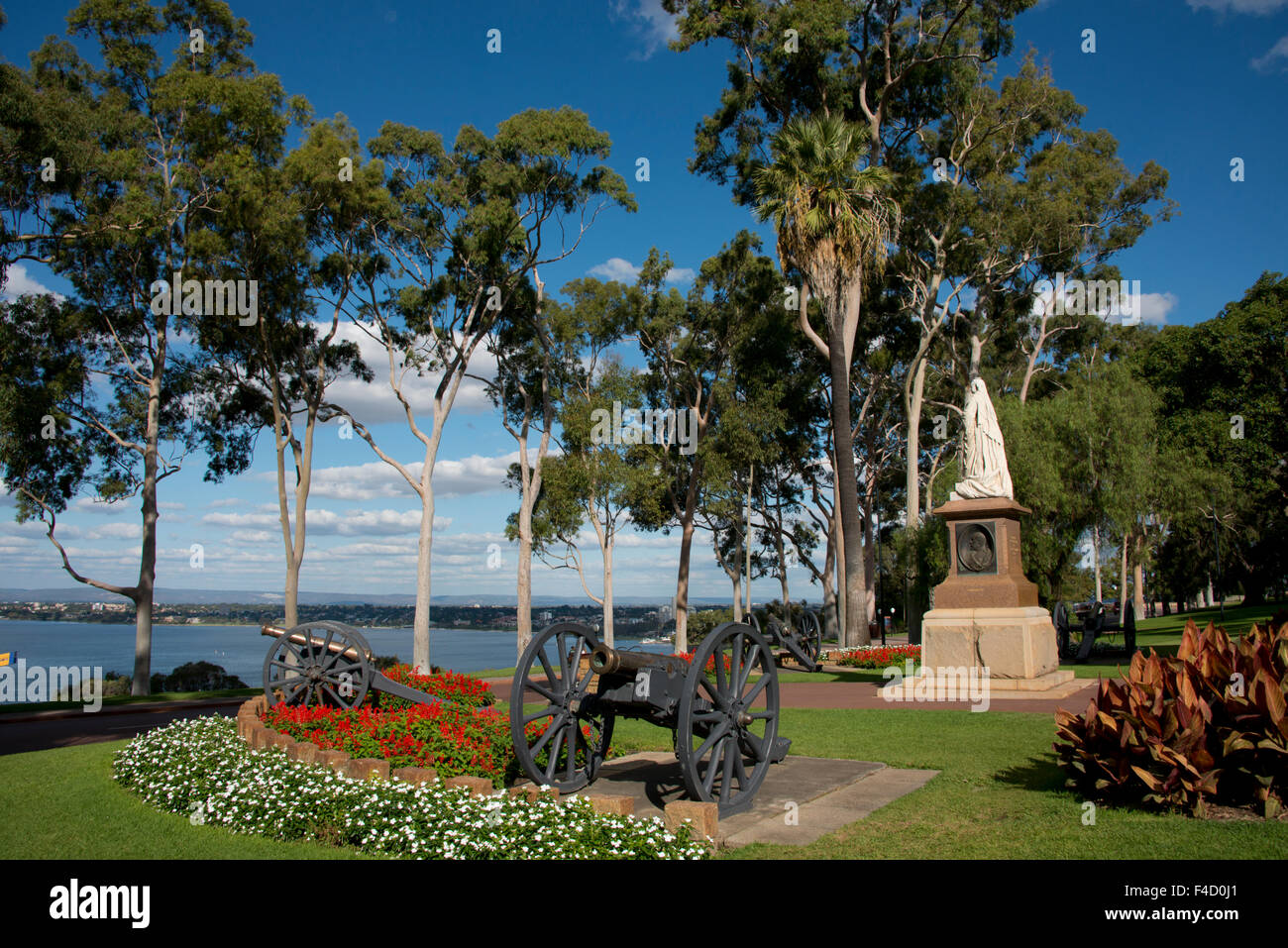 Australia, Perth. King's Park, Queen Victoria monument. Fraser Avenue, historic Lemon-scented gum tree lined road (Corymbia citriodora), planted in 1938. Swan River in distance. (Large format sizes available) Stock Photo