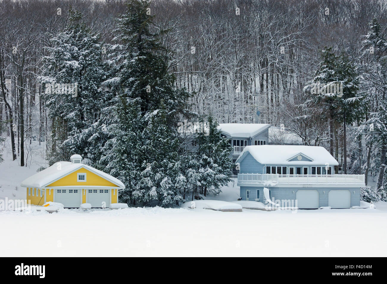 Canada, Ontario, Muskoka. Cottage and boathouse in winter. Credit as