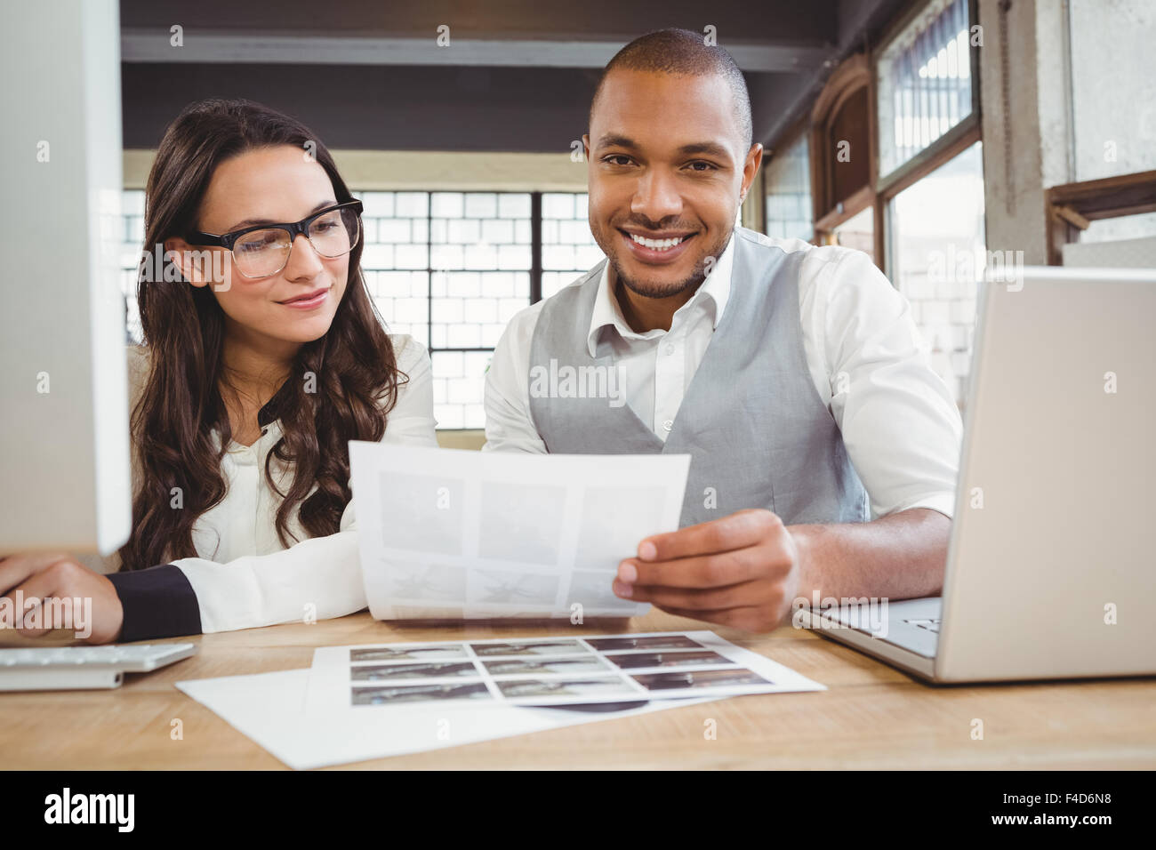 Portrait of man showing document Stock Photo