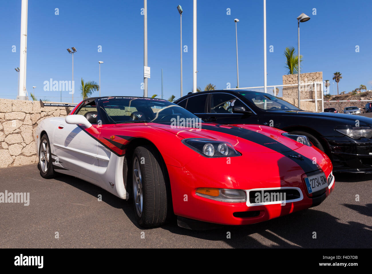 Red black white Corvette coupe in car park. Stock Photo