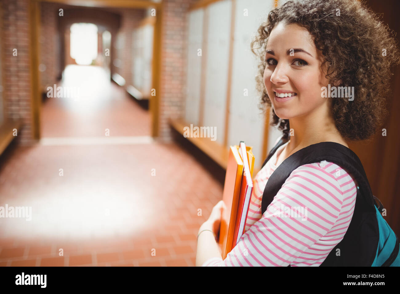 Pretty student smiling at camera Stock Photo - Alamy
