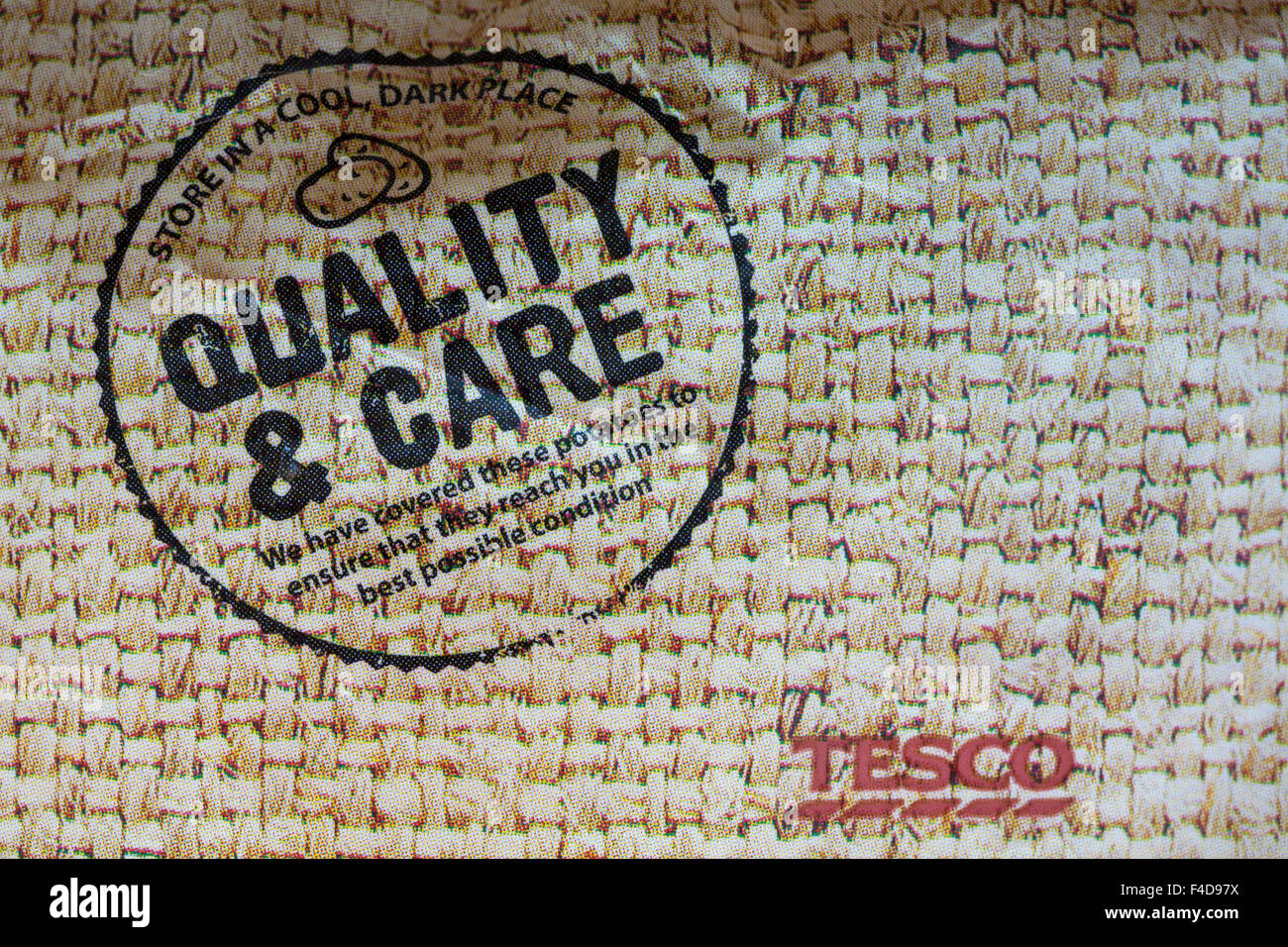 Store in a cool dark place Quality & Care sign on pack of Tesco potatoes Stock Photo