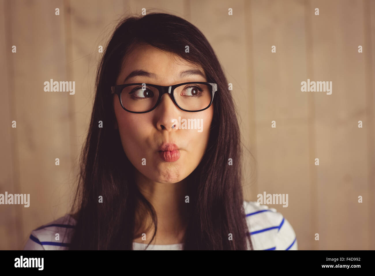 Young attractive woman grimacing for camera Stock Photo