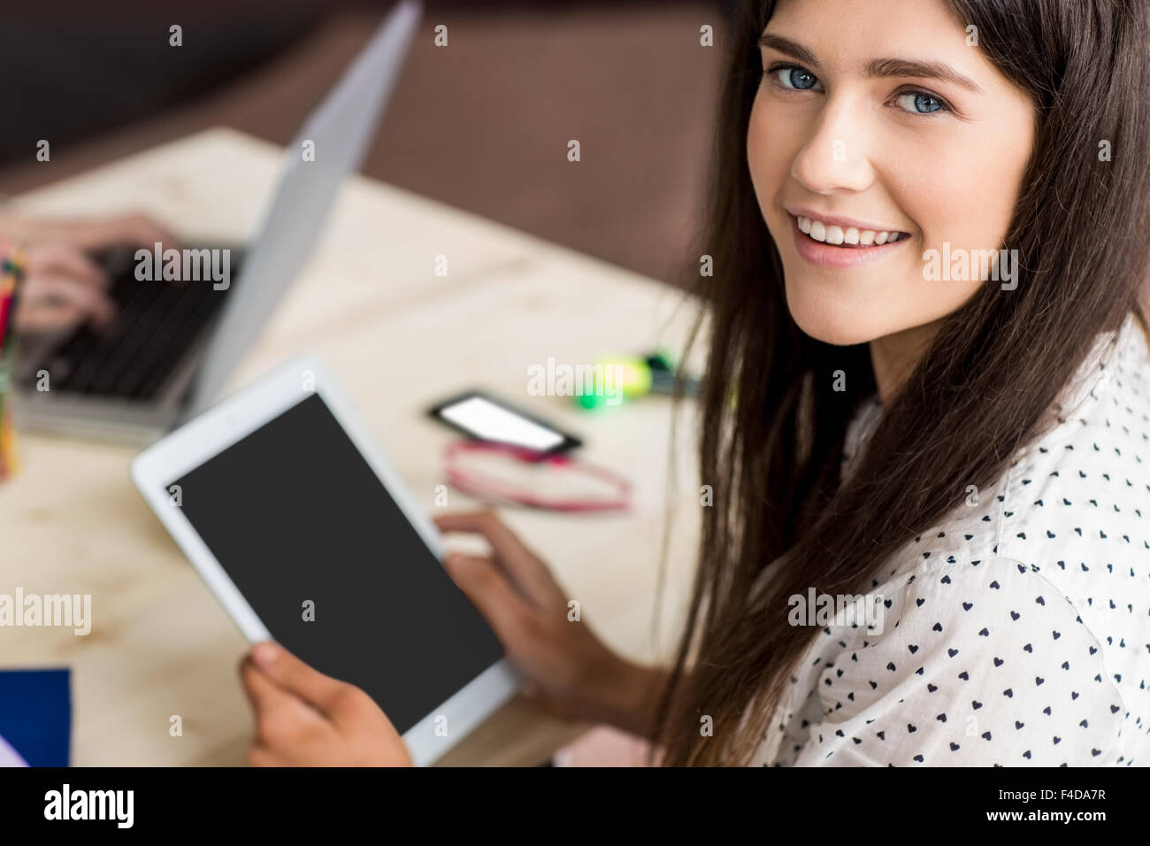 Student using tablet working on assignment Stock Photo