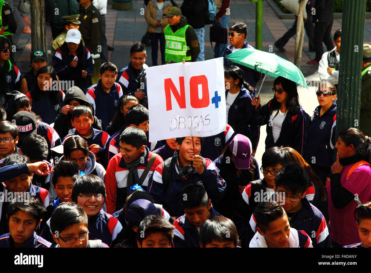 La Paz, Bolivia, 16th October 2015. A male student carries a placard saying 'No more drugs' during a march through La Paz city centre warning of the dangers of drug use. The demonstration is organised every year by the police together with schools and colleges to educate and raise awareness about drugs and their dangers. Credit: James Brunker / Alamy Live News Stock Photo