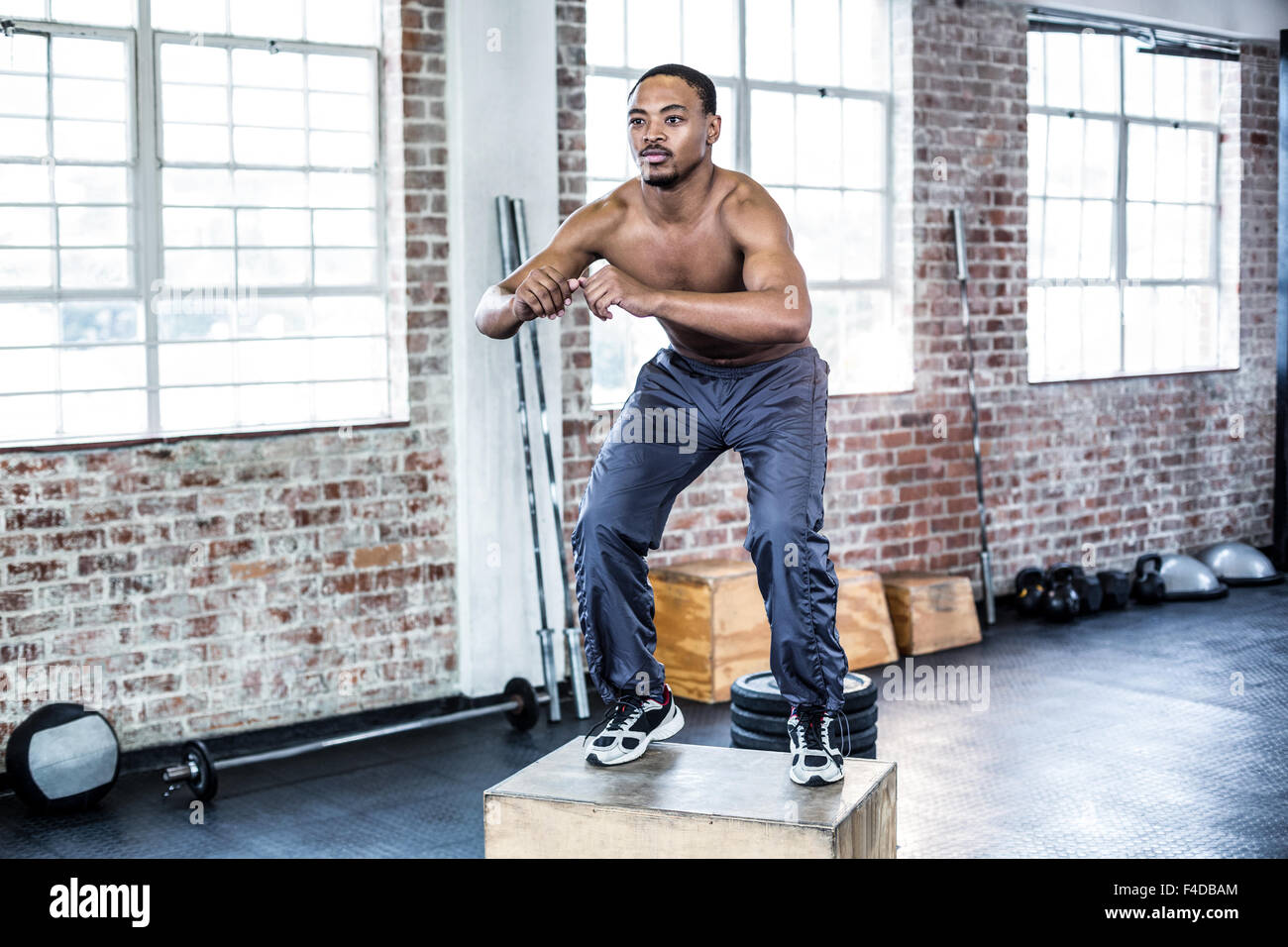 Fit man doing box jumps Stock Photo