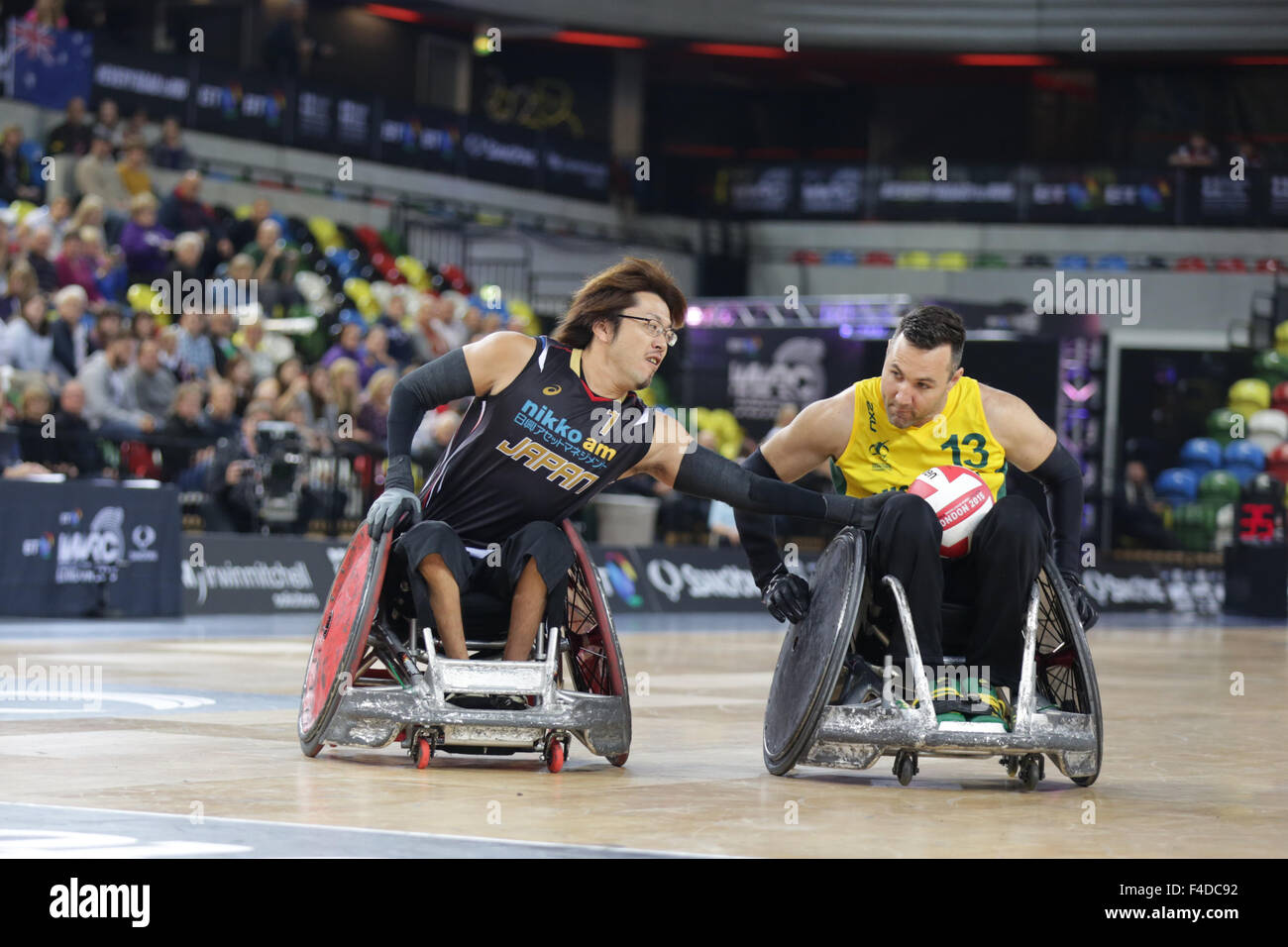 London, UK. 16th October, 2015. World Wheelchair Rugby Challenge Team Aus beat Japan 60-55 to win Bronze medal. Copperbox, Olympic Park, London, Wakayama of Japan tackles Carr of Aus. UK. 16th October, 2015. copyright carol moir/Alamy Live News Stock Photo