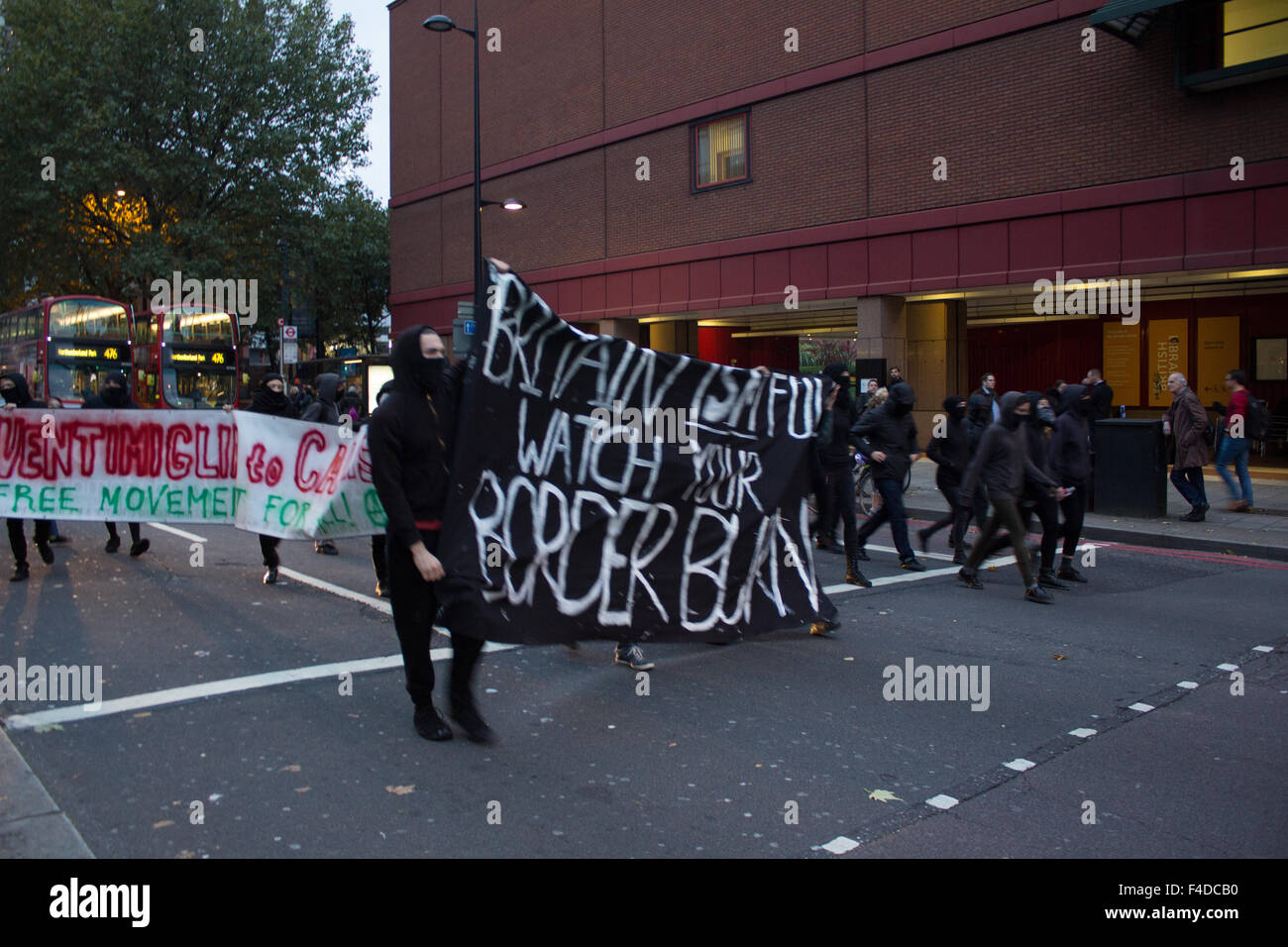 London, UK. 16th October, 2015. Anarchists, in coordination with London Black Dissidents, Sisters Uncut and The London Latinxs took Euston Road and marched on King's Cross Credit:  Louis Mignot/Alamy Live News Stock Photo