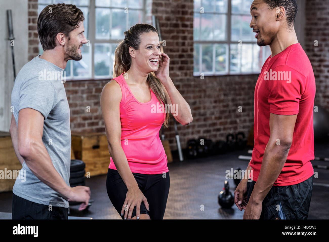 Three young athletes talking to each other Stock Photo