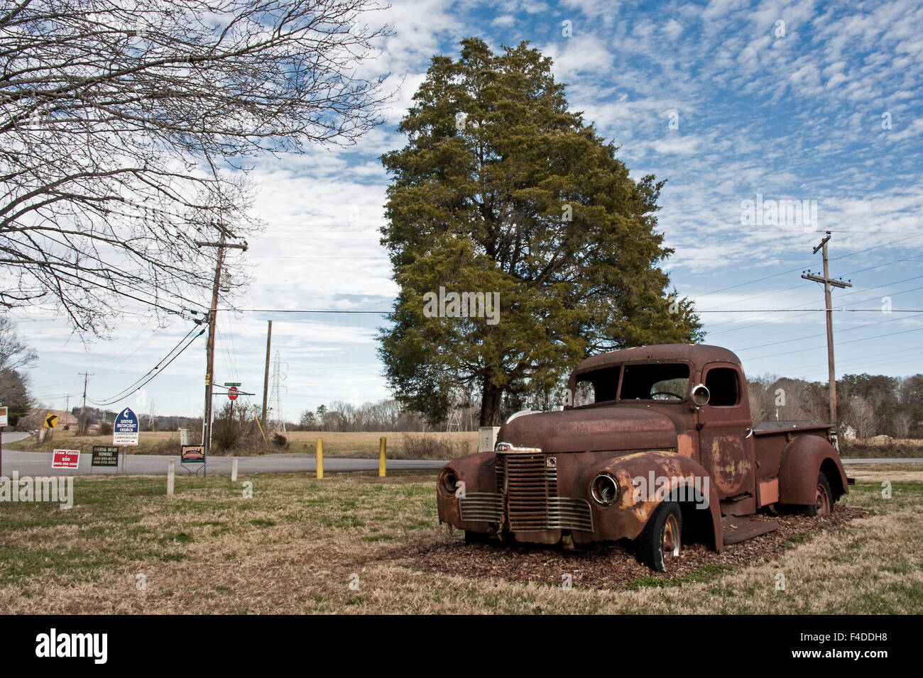 Abandoned car--1940s International pickup truck parked forever beside a rural American road Stock Photo