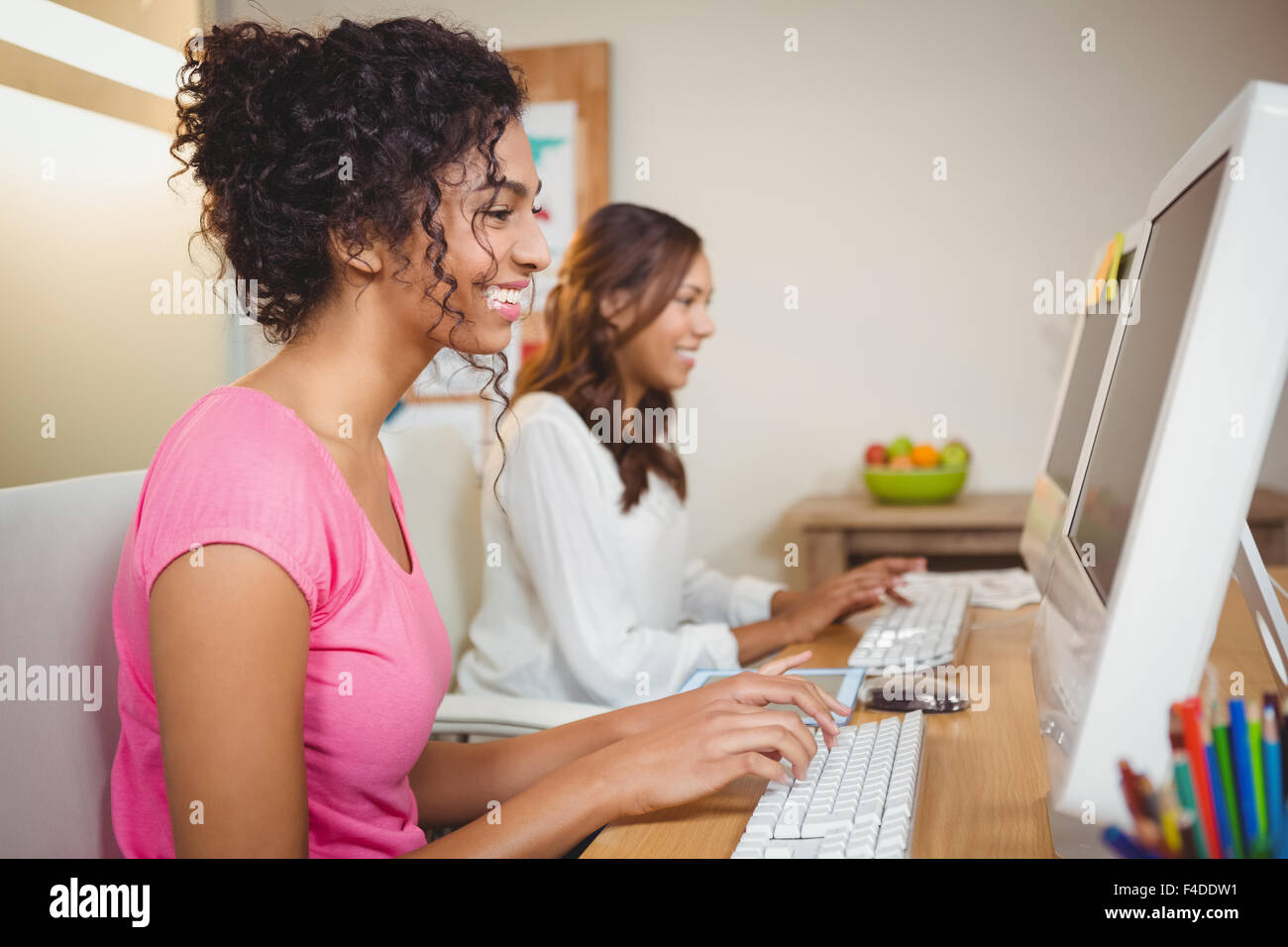 Businesswomen working on computer in office Stock Photo - Alamy