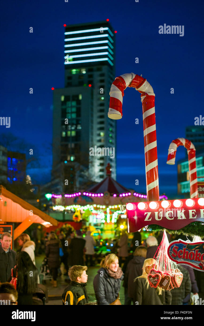 Germany, Berlin, Kurfurstendamm, City Christmas market and the Waldorf Astoria Hotel in the Zoofenster building, dusk Stock Photo