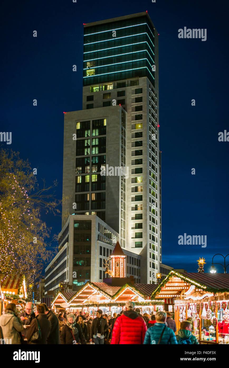 Germany, Berlin, Kurfurstendamm, City Christmas market and the Waldorf Astoria Hotel in the Zoofenster building, dusk Stock Photo