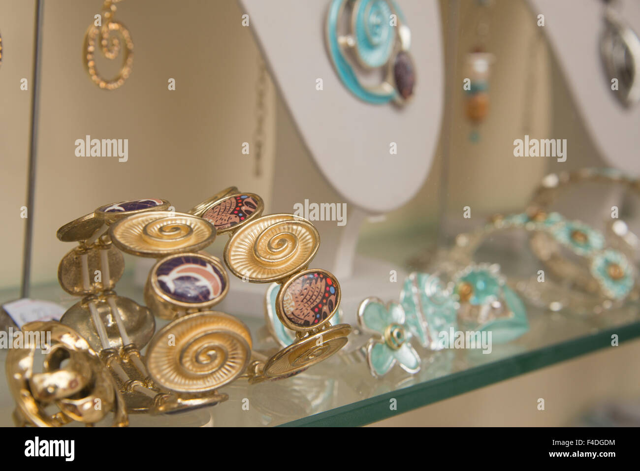 Greece, Cyclades, Mykonos, Hora. Typical gold enamel jewelry in shop window. (Large format sizes available) Stock Photo