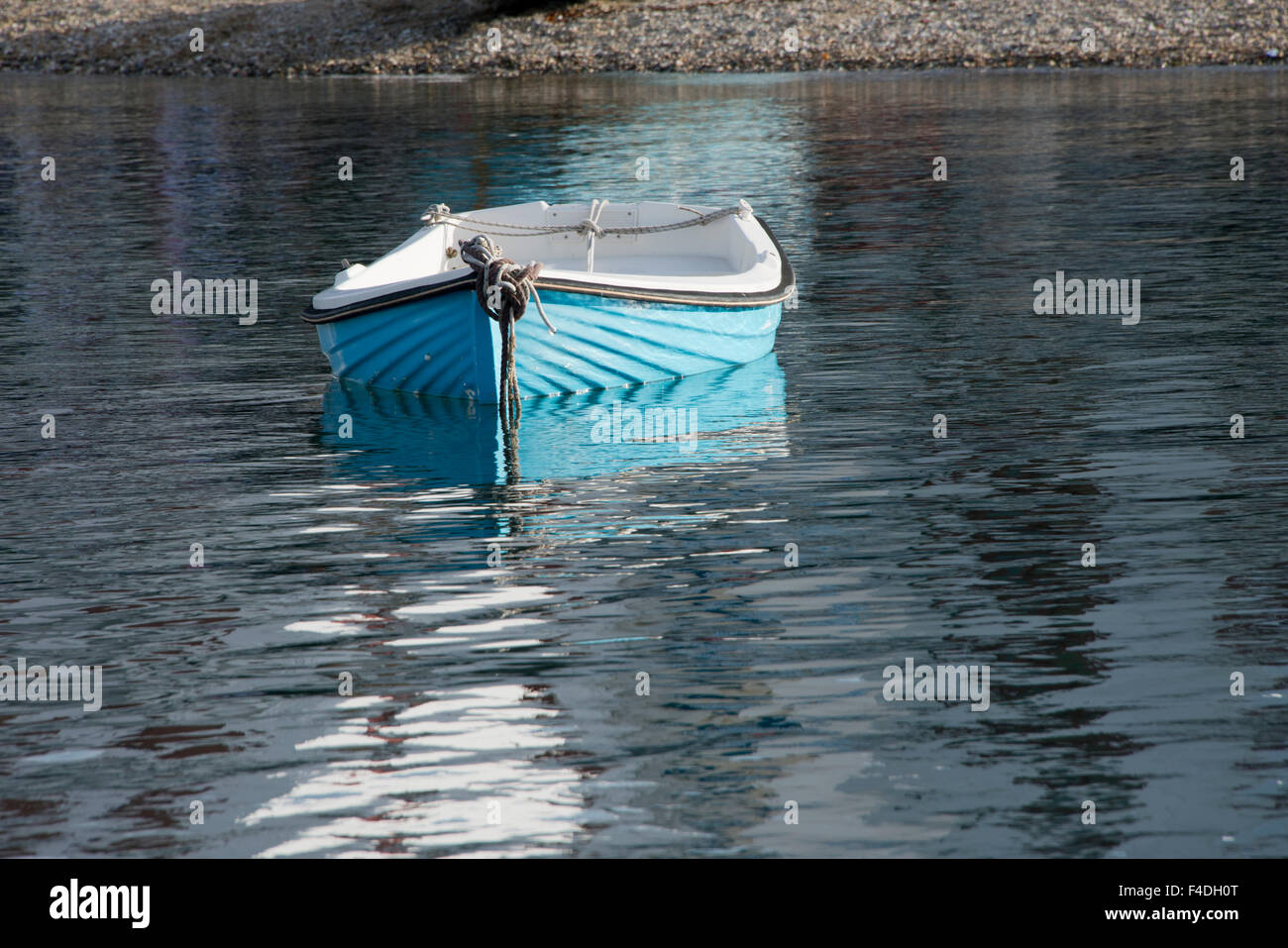 Greece, Cyclades, Mykonos, Hora. Blue fishing boat with reflection. (Large format sizes available). Stock Photo