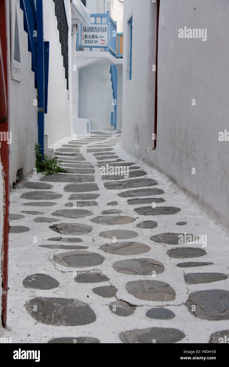 Greece, Cyclades, Mykonos, Hora. Typical whitewashed alley with blue trimmed buildings. (Large format sizes available). Stock Photo