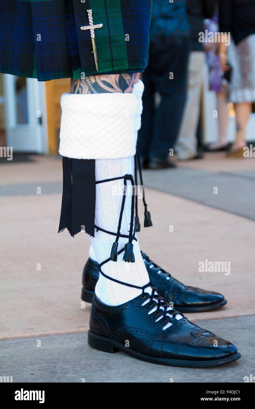 Traditional Scottish wedding day attire of a kilt worn by the groom