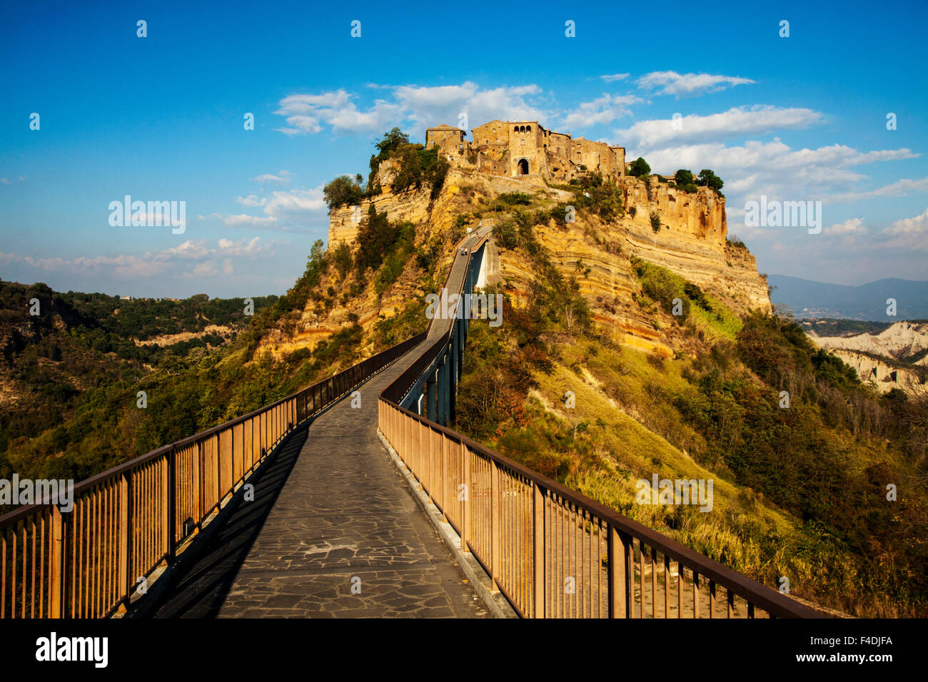 Evening view of Civilta di Bagnoregio and the long bridge leading to ...