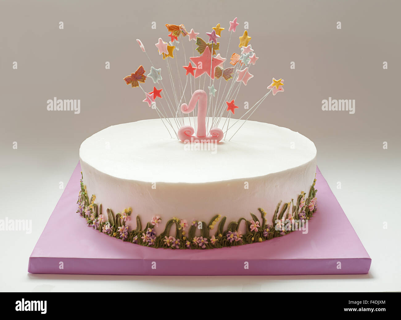 Birthday cake with number one and stars on top. Stock Photo