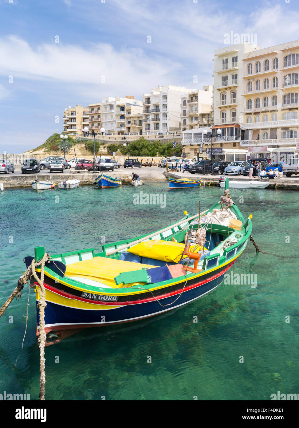 The island of Gozo in the Maltese archipelago. The former fishing village Marsalforn with modern hotel buildings and traditional fishing boats called Luzzu in the harbor. Europe, Southern Europe, Malta. (Large format sizes available) Stock Photo