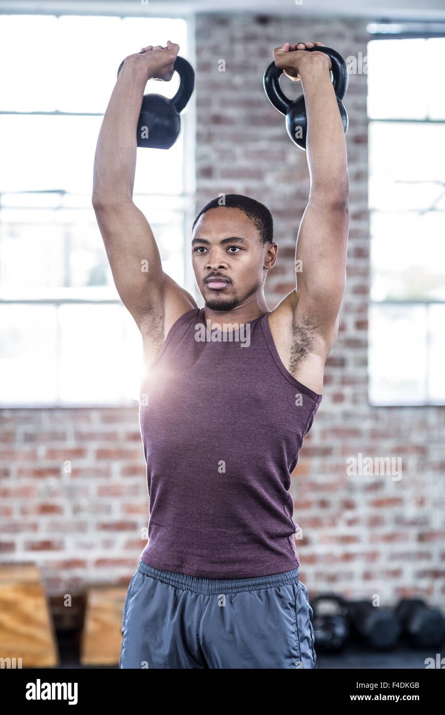 Strong black man lifting weights hi-res stock photography and images ...