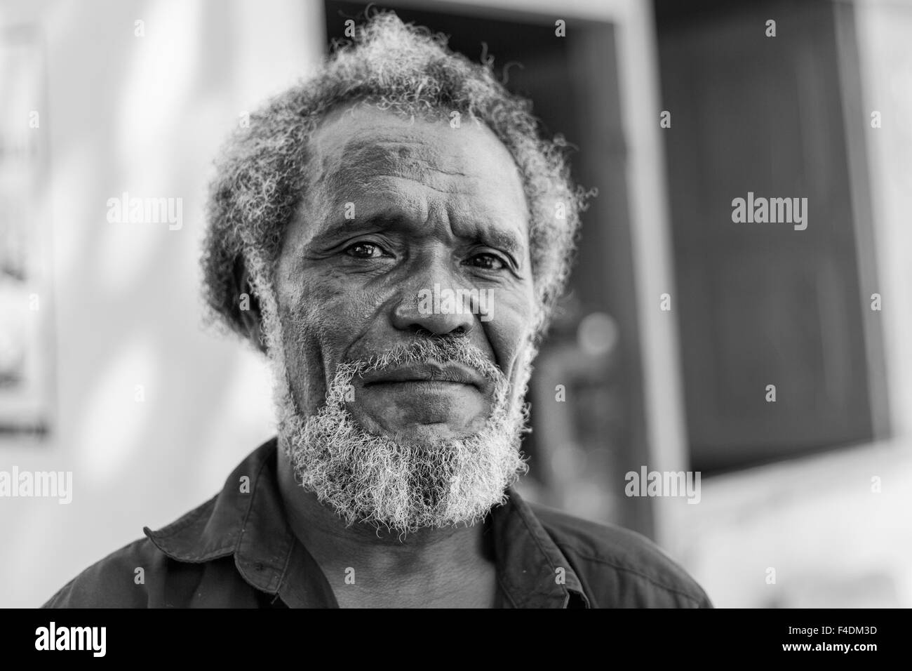 Liquica, East Timor - June 23, 2012: Portrait of an unidentified East Timorese native leaving his house to vote on election day Stock Photo